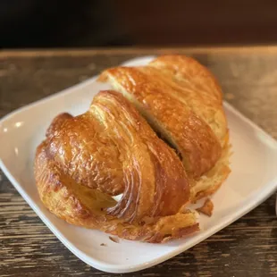 a croissant and a cup of coffee