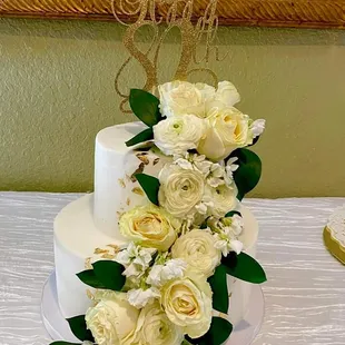 a wedding cake with white flowers
