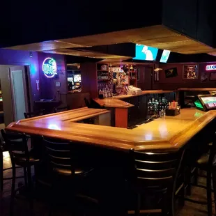 a bar with a laptop on the counter