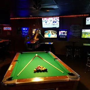 a pool table in a bar