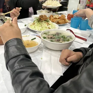 a group of people eating at a table