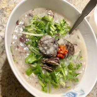 Chao with minced pork, thousand yr old egg and sausage. To go order.