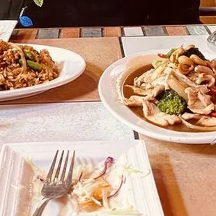 Special Basil fried rice with chicken, cashew chicken, fried spring rolls and ginger salad.