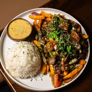 Lomo Saltado with house green sauce