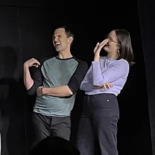a man and a woman on stage