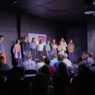 a group of people on stage