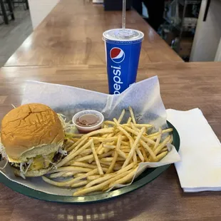 The Deluxe double. American cheese, grilled onion, lettuce, tomato, pickle, burger sauce.