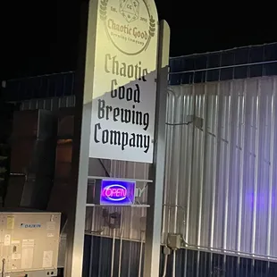 a sign in front of a building