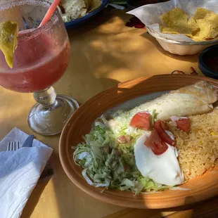 Here I got the fried chimichanga with chicken and rice it came with sour cream, guacamole, and lettuce with tomatoes it was very tasty.
