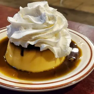 a dessert with whipped cream on top