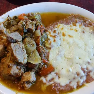 Chile Verde plate with refried beans and cheese