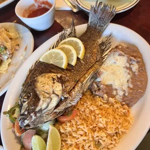 a plate of fish and rice