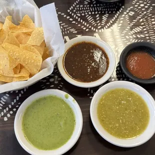 Sampling the salsas - Top to bottom, L to R: red tomatillo, table salsa, avocado salsa, and green tomatillo salsa.