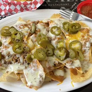 Beef and bean nachos with extra jalapeños