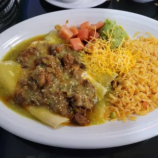 Enchiladas Rancheras with green sauce instead of red and no lettuce (cheese enchiladas topped with pork)