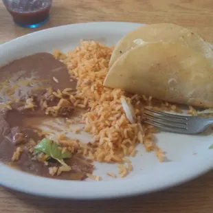 Was so hungry I started eating before I took the picture of 3 soft tacos, rice &amp; beans. Just wish they had sweet tea!