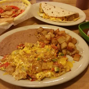 Chilequiles plate, potato,egg with bacon and cheese taco and a Big Red of course!