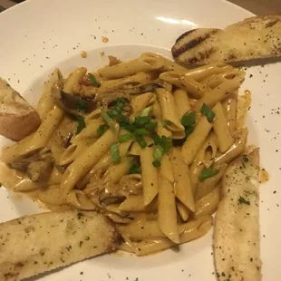 a plate of pasta and bread