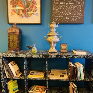 a bookshelf with books and a vase