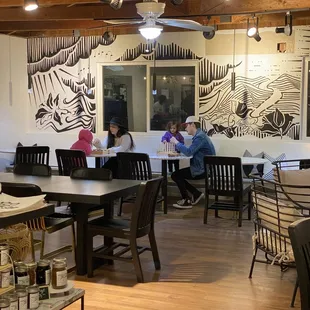 a group of people sitting at tables