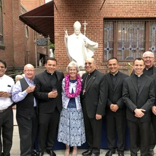 Venerating the statue of St. John Paul II that was donated by Michael Rabara our General Manager and Staff of Chapel of the Light Funeral