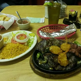 Fiesta Plate $7.99. It includes Fajitas, Rib, Sausage, Shrimp + Rice/Beans, Tortillas.