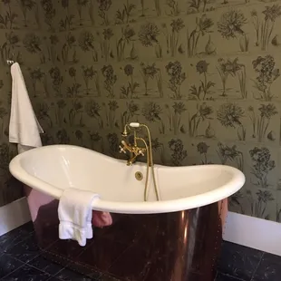 Take a long relaxing bath in this copper soaker tub.