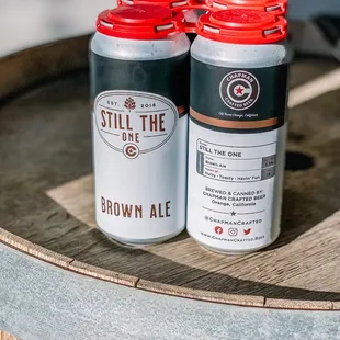 two cans on a barrel