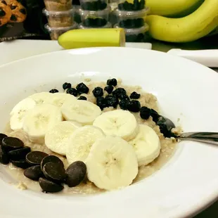 Oatmeal with brown sugar, bananas, blueberries and chocolate chips.