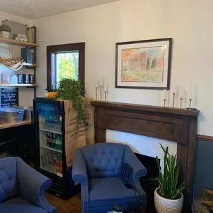 blue chairs and a fireplace