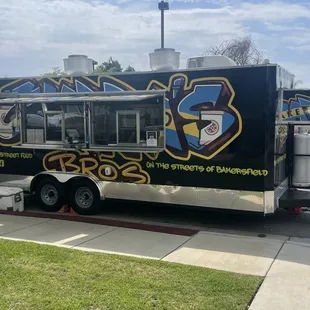 a food truck parked on the side of the road