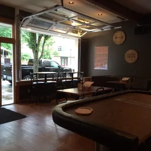 Great new menu. Try the beef brisket and smoke house sampler. Great service!  Really cool setting open to the street!