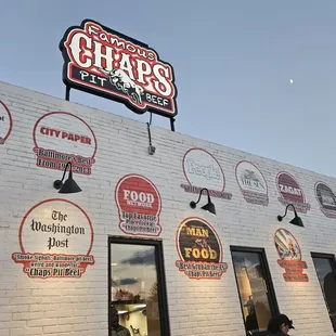 Awards on remodeled building facade and in new dining area (Summer 2024).