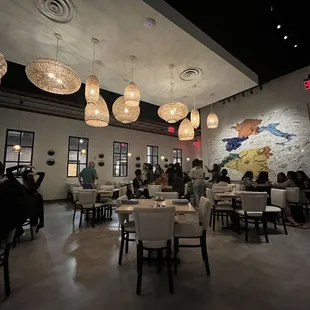 a dining room with a lot of people