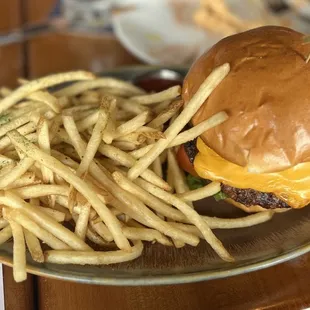 $20 Royale with Cheese (amerian wagyu beef patty, secret suance, american cheese, grilled onion, tomato, lettuce, pickles, brioche bun,fries