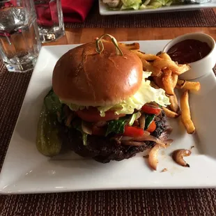 a hamburger and fries on a plate