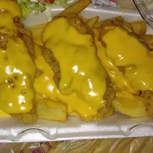 Special request: chicken strip basket smothered in cheese sauce.