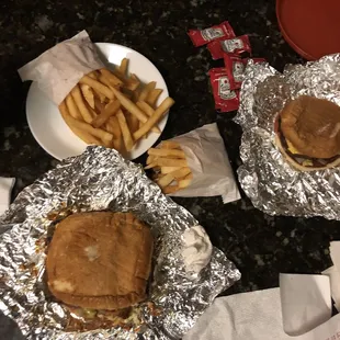 two sandwiches and french fries