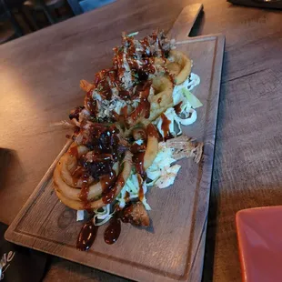 Smoked Pulled pork on onion rings with Cole slaw underneath-- great appetizer!