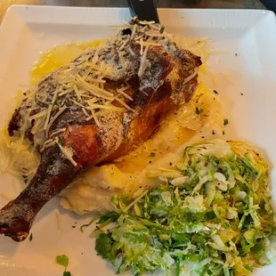Half smoked chicken with mashed potatoes and shaved Brussel sprouts