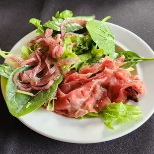 Carpaccio and pickled onions that were herbed &amp; delicate on their vinegar flavor notes.
