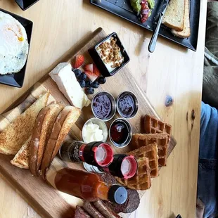Breakfast Board, Avocado Toast, Parfait, and side of eggs.
