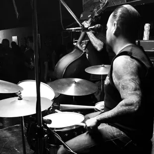 a man playing drums in a band