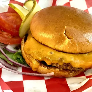 &quot;Flattop&quot; Burger. Cooked to temperature. Served with lettuce, tomatoes, sliced red onion, and pickles.