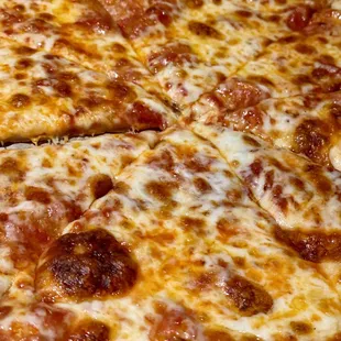 Cheese Pizza. Made with hand rolled dough and baked in their brick oven.