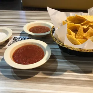 Complimentary chips with mild, spicy and spicy each sauce.