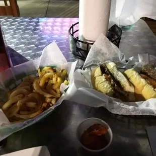 Cheesesteak sandwich and curly fries
