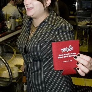 a woman holding a box of food