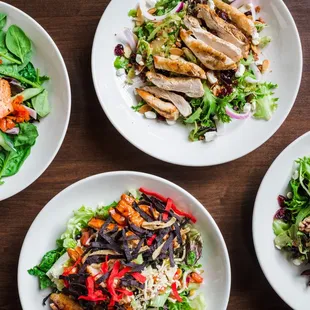 three plates of salads
