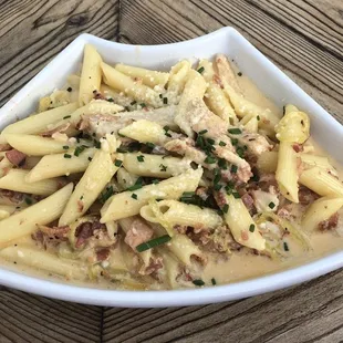 Spicy chicken carbonara with local hot peppers.